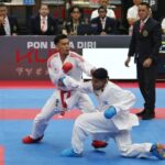 Sudut merah: Atlet karate Jawa Timur, Ignatius Joshua Kandaou, dalam ajang PON Bela Diri 2025 di Kudus, Jawa Tengah, Kamis (23/10/2025) | Foto: Dimas AP/BI
